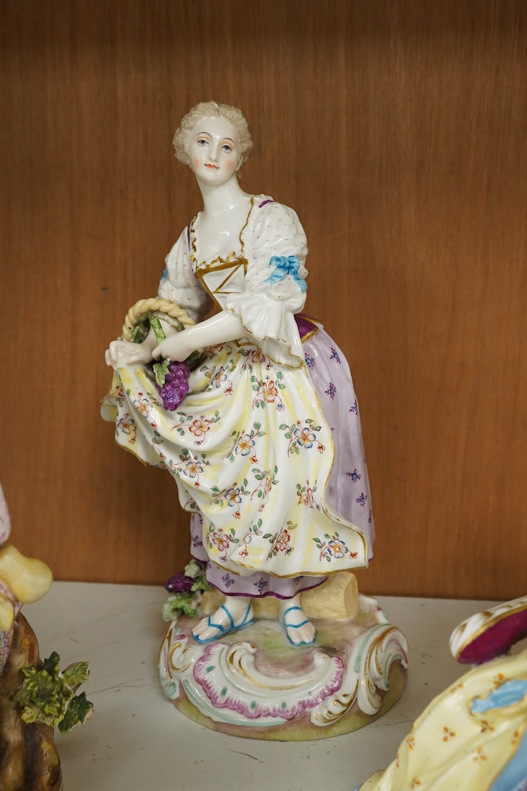 A Meissen style porcelain musical group, a figurine of a lady holding grapes and a two Derby figures of Summer and Autumn, c.1810-30, largest 24cm high